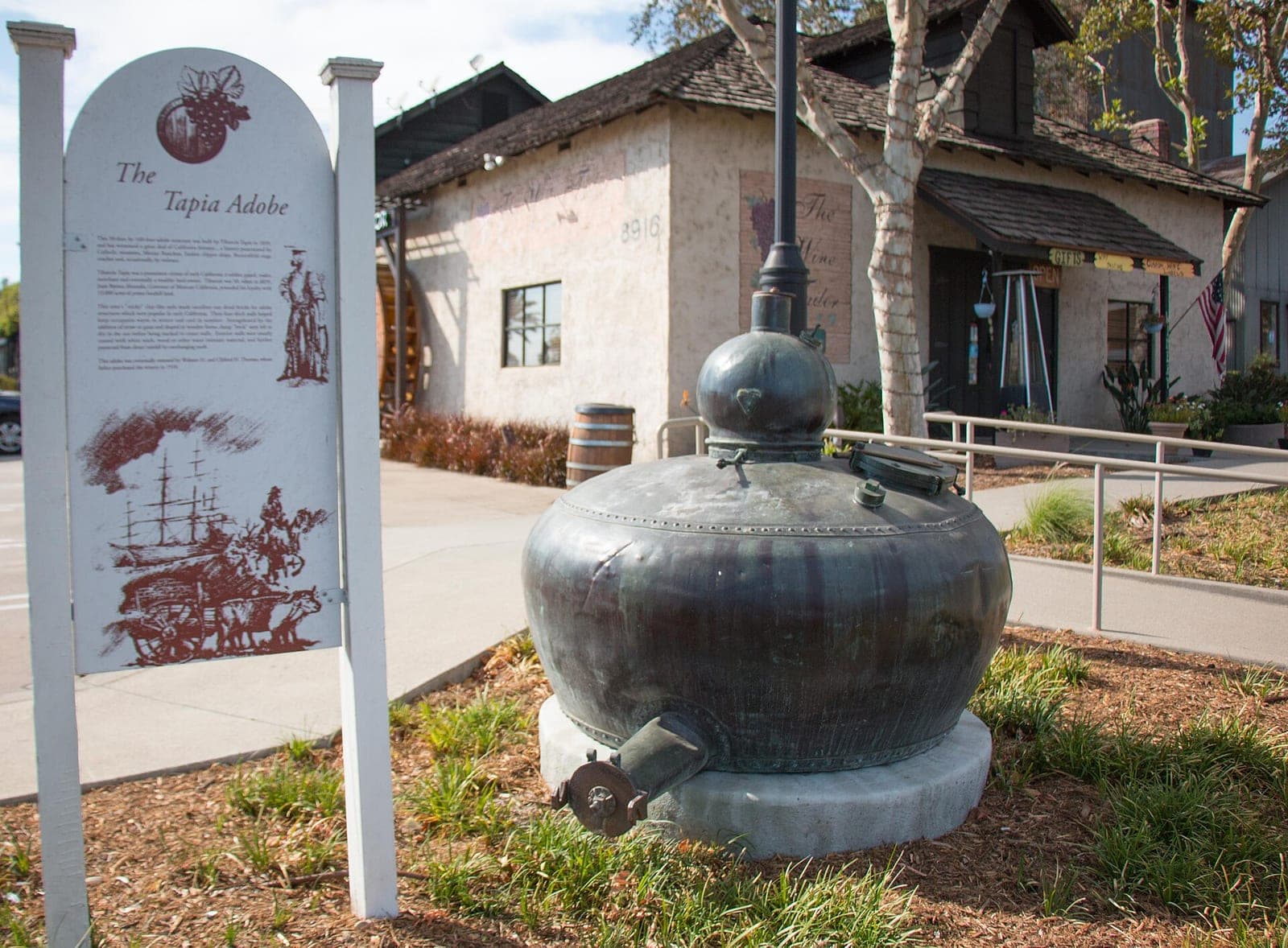 The historic Thomas Winery landmark building in the plaza that houses Klatch Coffee's flagship